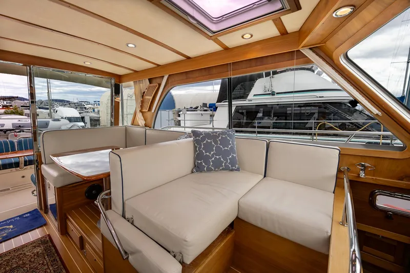 Slide: The Image of Interior of 2014 Sabre 38 Salon Express yacht with plush seating and elegant wood finish. - 8