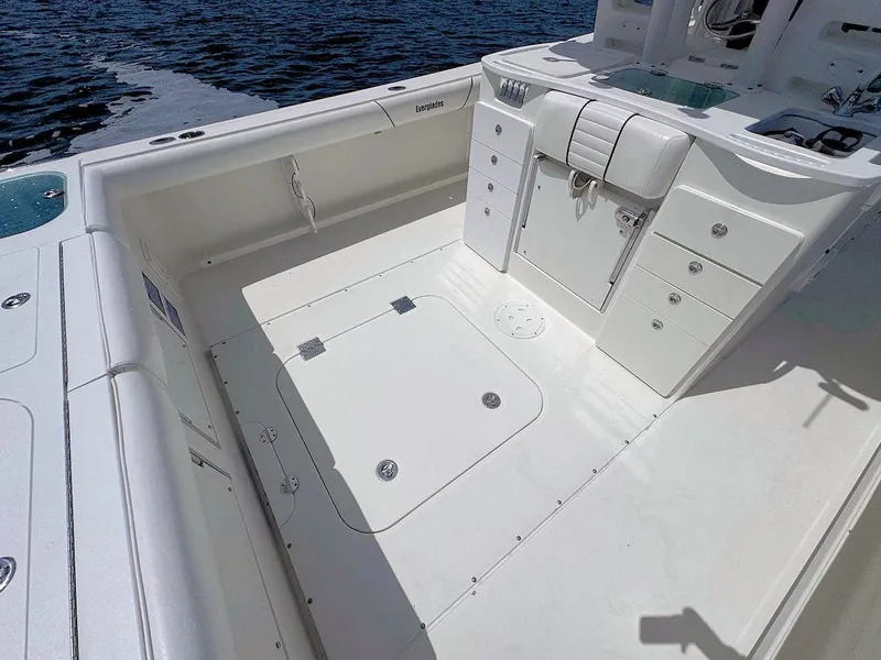 Slide: The Image of Spacious deck of 2010 Everglades 350 CC boat with storage compartments. - 10