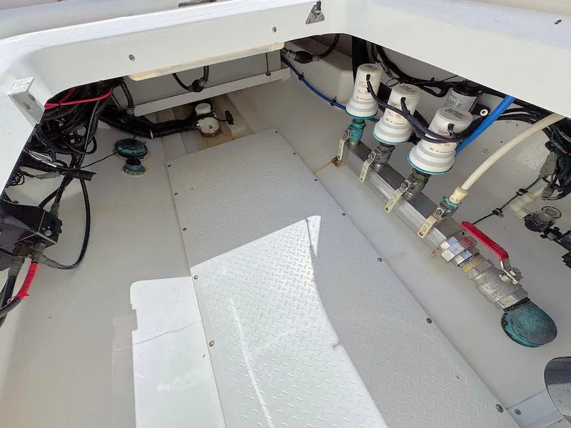 Slide: The Image of Interior view of a 2010 Everglades 350 CC boat showing mechanical components and wiring. - 15