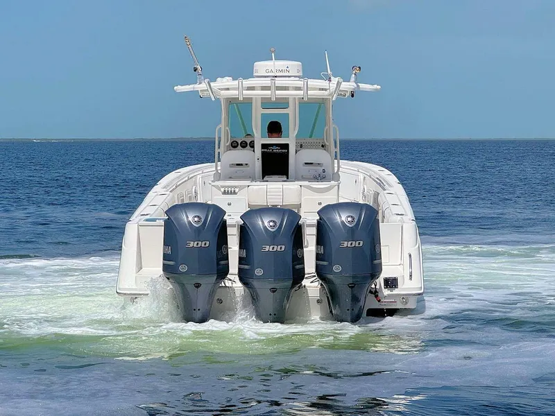 Slide: The Image of Everglades 350 CC boat with triple Yamaha 300 engines on open water, 2010 model. - 5