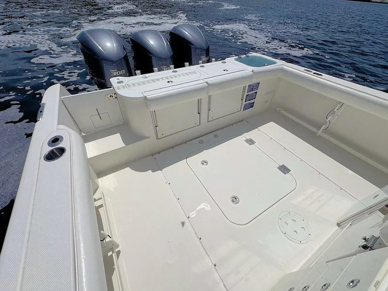 Slide: The Image of Everglades 350 CC 2010 boat with triple engines on open water. - 6