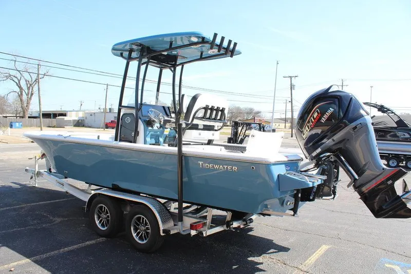Slide: The Image of 2025 Tidewater 2300 CB boat on trailer, blue hull, dual engines, outdoor setting. - 10