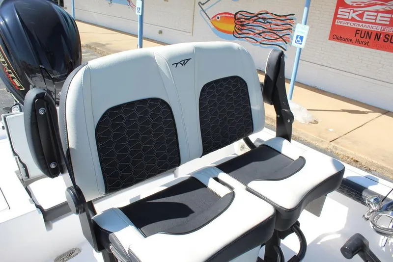 Slide: The Image of 2025 Tidewater 2300 CB boat seats with black and white design, outdoor setting. - 22