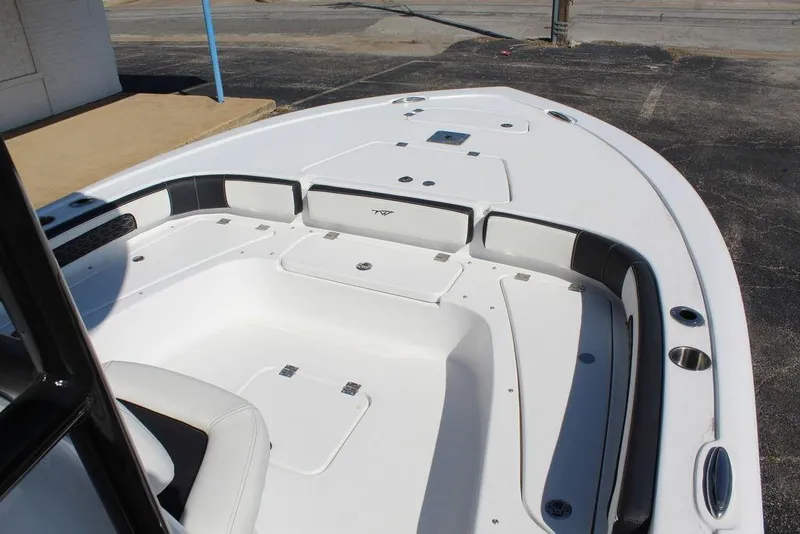 Slide: The Image of 2025 Tidewater 2300 CB boat deck with seating and storage compartments. - 24