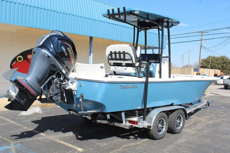 Slide: The Image of 2025 Tidewater 2300 CB boat on trailer, blue hull, parked outdoors. - 5