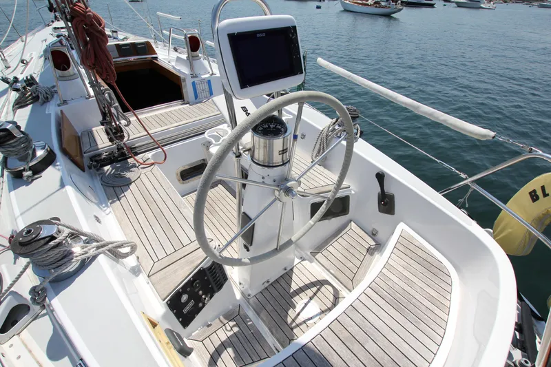 Slide: The Image of Cockpit of 1974 Nautor Swan 38 sailboat with steering wheel and navigation equipment. - 10