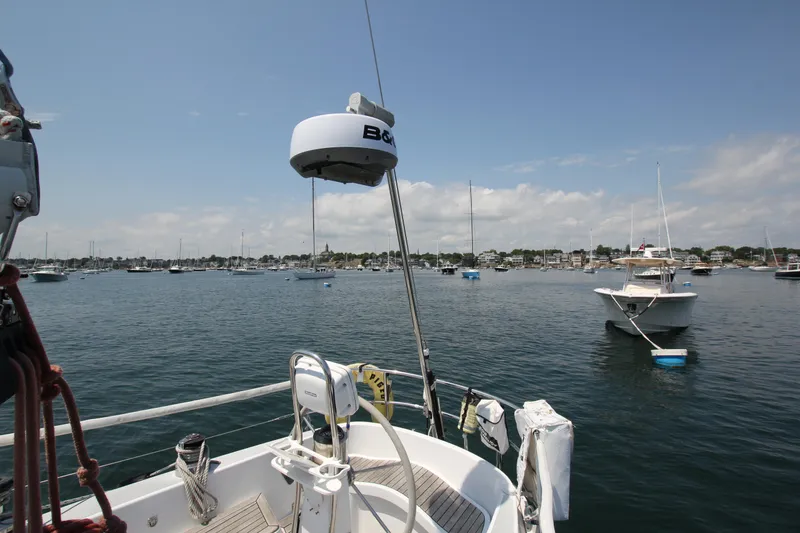 Slide: The Image of Sailboat deck view of a 1974 Nautor Swan 38 in a calm harbor. - 15