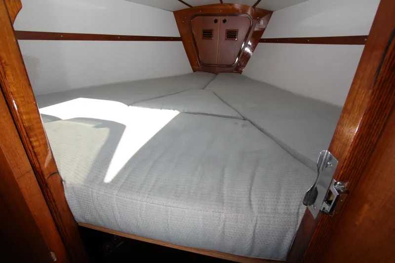 Slide: The Image of Cozy cabin interior of 1974 Nautor Swan 38 sailboat with comfortable bedding. - 17