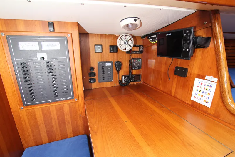 Slide: The Image of 1974 Nautor Swan 38 yacht interior with navigation equipment and control panel. - 26