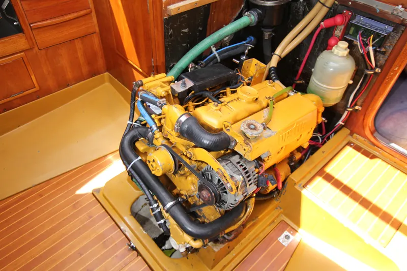 Slide: The Image of Engine of a 1974 Nautor Swan 38 sailboat, showcasing detailed mechanical components. - 31