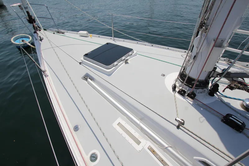 Slide: The Image of Deck of 1974 Nautor Swan 38 sailboat, featuring sleek design and rigging details. - 5