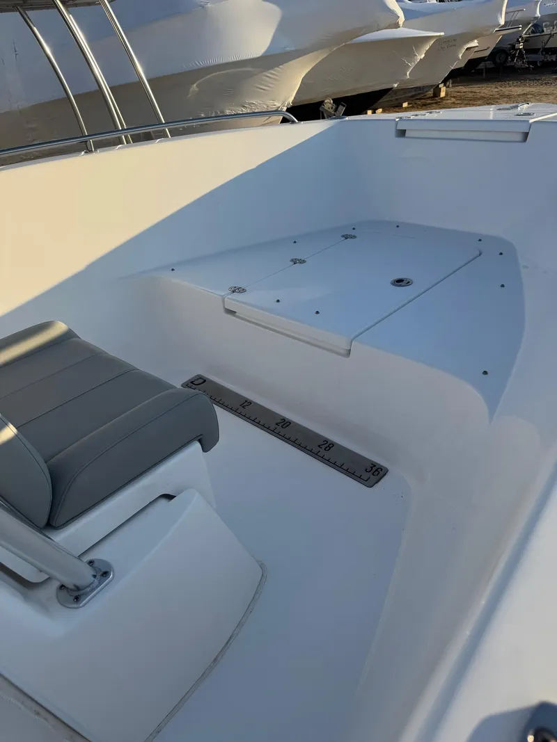 Slide: The Image of 2022 Cape Horn 22 OS boat interior with seating and storage compartment. - 17