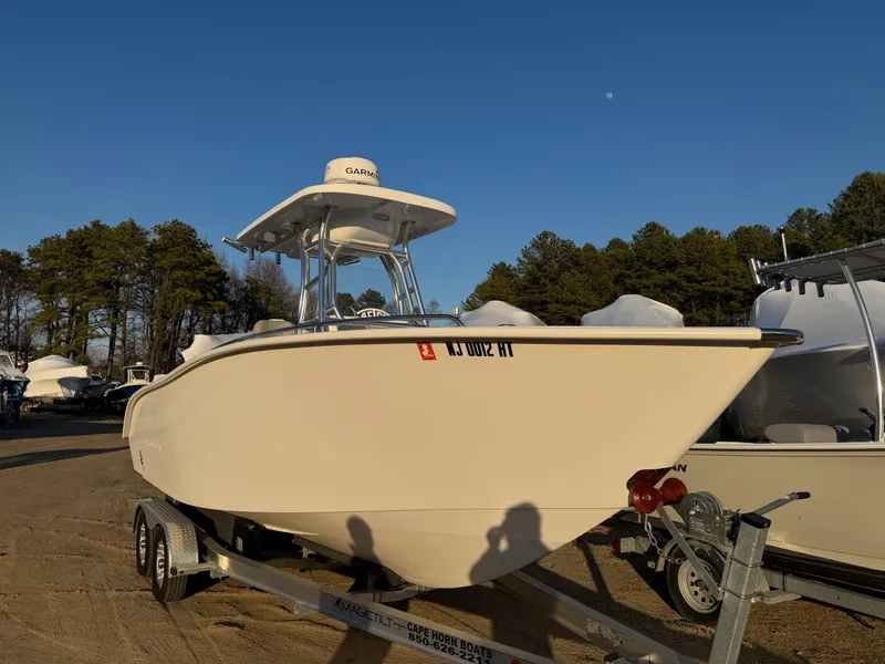 Slide: The Image of 2022 Cape Horn 22 OS boat on trailer, parked outdoors under clear blue sky. - 18
