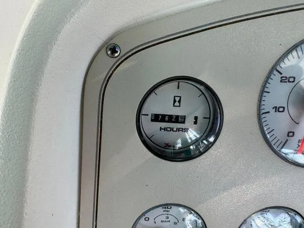 Slide: The Image of Hour meter on 1995 Cruisers Yachts 3175 Rogue dashboard, showing 762.9 hours. - 19