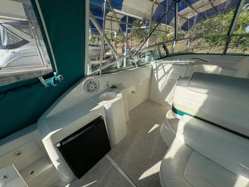 Slide: The Image of Interior of 1995 Cruisers Yachts 3175 Rogue with seating and helm area. - 6