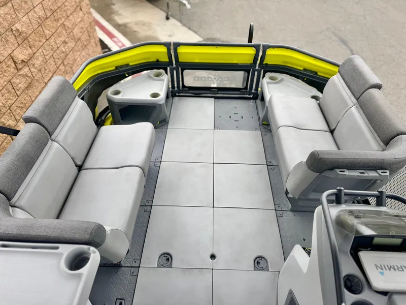 Slide: The Image of 2023 Sea-Doo Switch Cruise 18 interior with gray seating and yellow accents. - 10