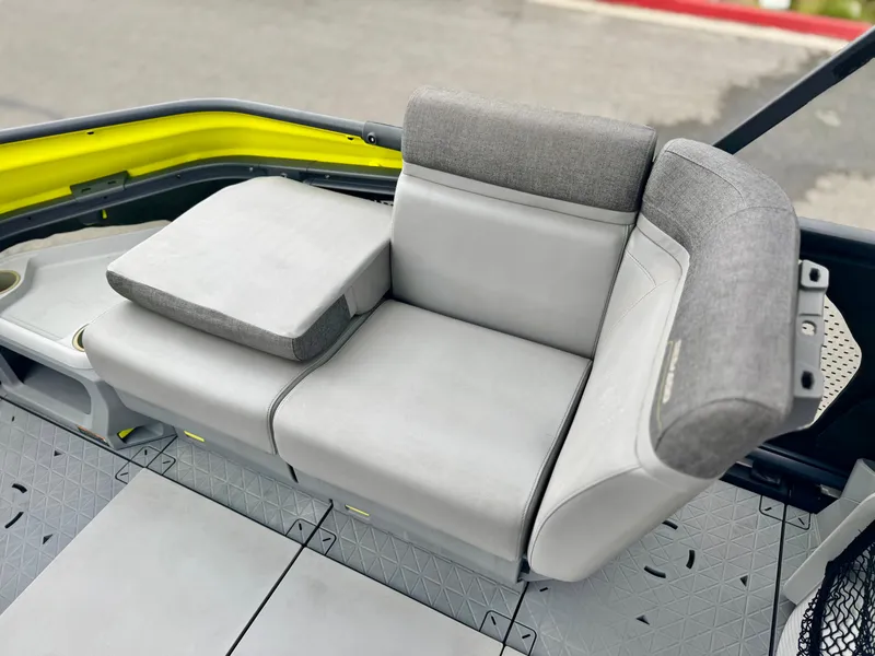 Slide: The Image of 2023 Sea-Doo Switch Cruise 18 seating area with gray cushioned seats and modern design. - 14