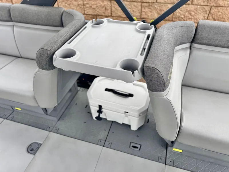 Slide: The Image of 2023 Sea-Doo Switch Cruise 18 interior with seating, table, and cooler. - 15