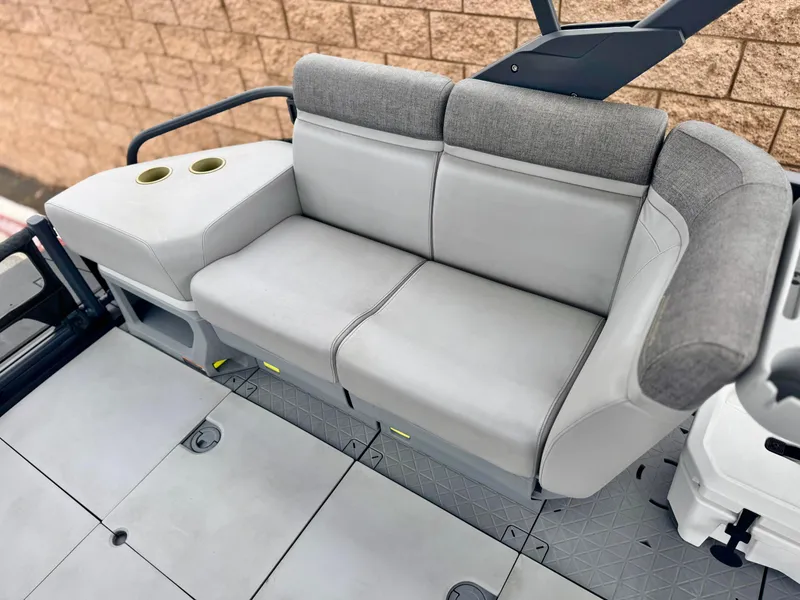 Slide: The Image of 2023 Sea-Doo Switch Cruise 18 interior seating with cup holders, gray upholstery. - 19