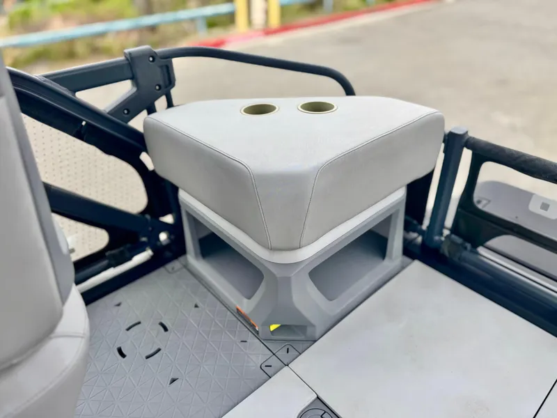 Slide: The Image of 2023 Sea-Doo Switch Cruise 18 interior with cushioned seating and cup holders. - 20