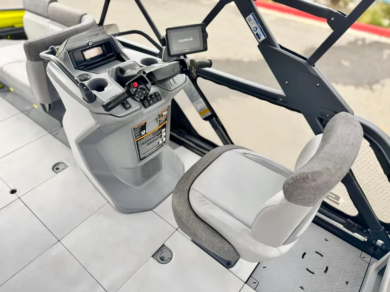 Slide: The Image of 2023 Sea-Doo Switch Cruise 18 cockpit with steering console and seating. - 21
