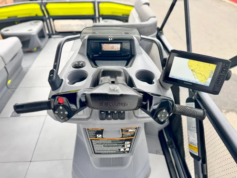 Slide: The Image of 2023 Sea-Doo Switch Cruise 18 dashboard with steering, controls, and navigation display. - 22