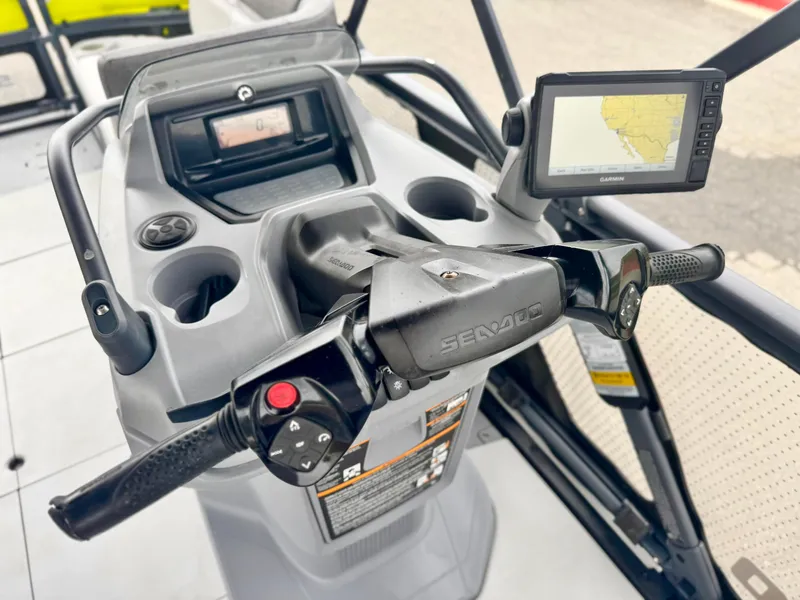 Slide: The Image of 2023 Sea-Doo Switch Cruise 18 dashboard with steering controls and navigation display. - 23