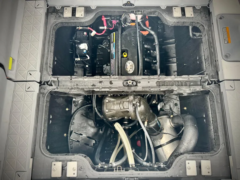 Slide: The Image of Engine compartment of 2023 Sea-Doo Switch Cruise 18, showcasing internal components and layout. - 26
