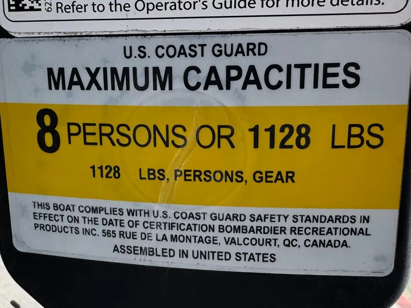 Slide: The Image of 2023 Sea-Doo Switch Cruise 18 capacity label: 8 persons or 1128 lbs, U.S. Coast Guard compliant. - 30