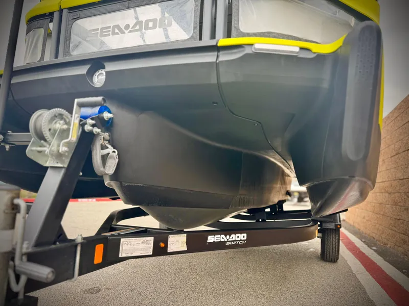 Slide: The Image of 2023 Sea-Doo Switch Cruise 18 on trailer, close-up view of hull and hitch. - 4