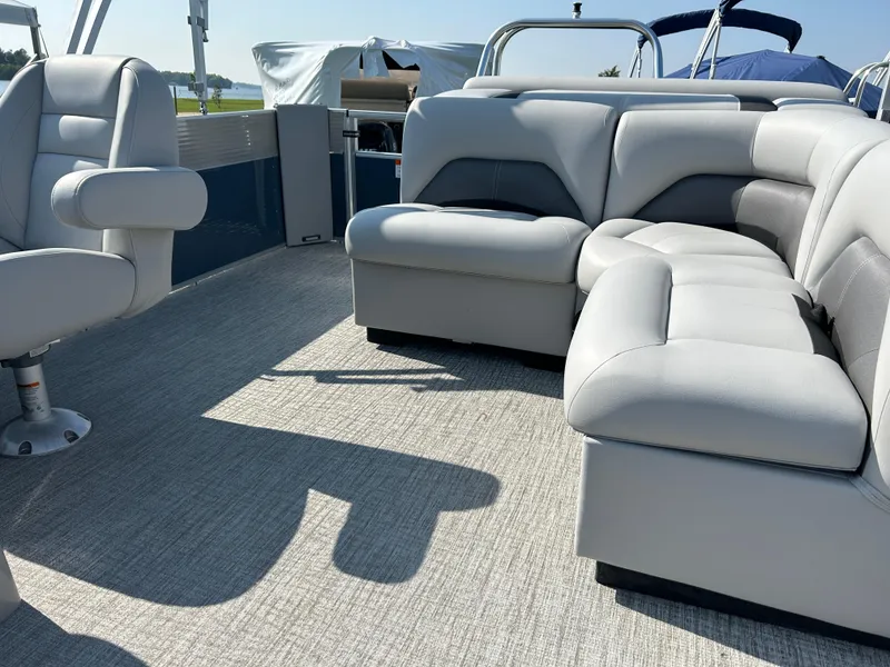 Slide: The Image of 2023 Landau Island Breeze 232 Cruise pontoon boat with spacious seating and modern dashboard. - 10