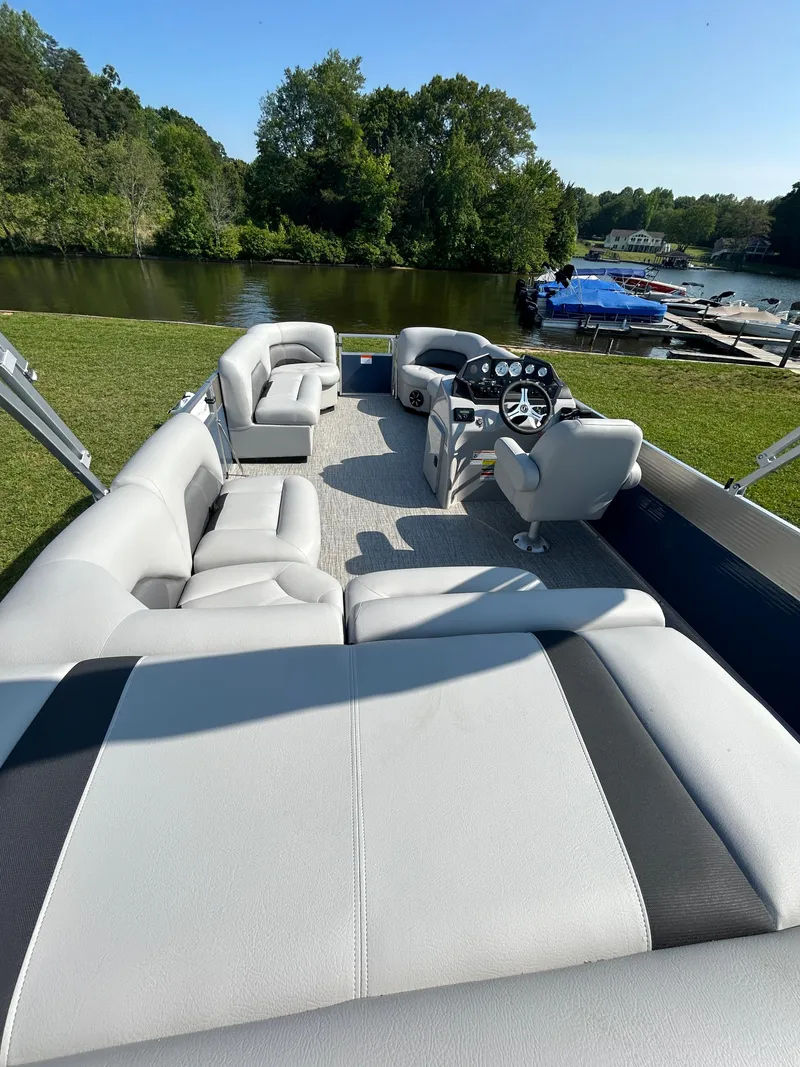 Slide: The Image of 2023 Landau Island Breeze 232 Cruise pontoon boat interior with lake view. - 11