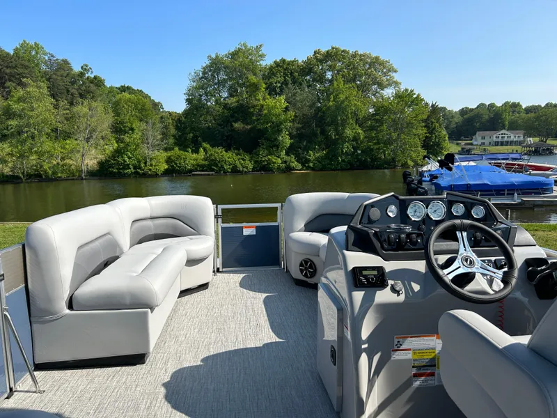 Slide: The Image of 2023 Landau Island Breeze 232 Cruise pontoon boat with spacious seating and modern design. - 4