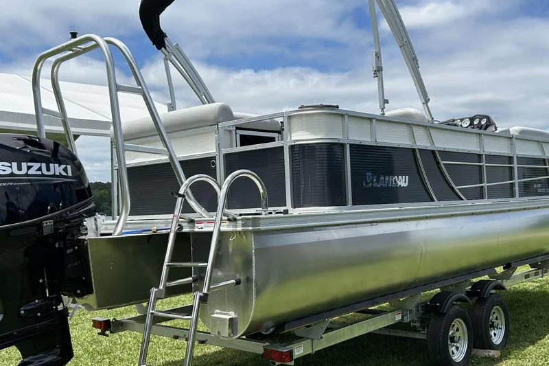 Slide: The Image of 2023 Landau Island Breeze 232 Cruise pontoon boat with Suzuki engine on trailer. - 5