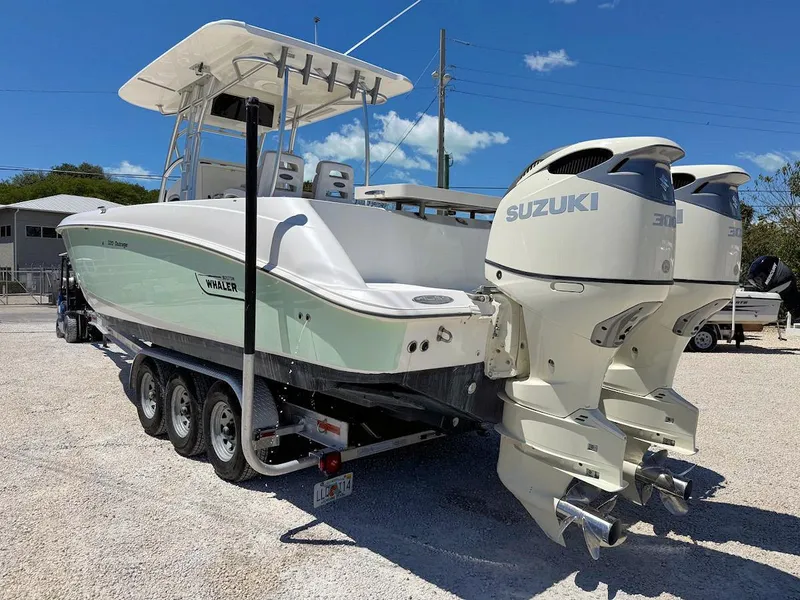 Slide: The Image of 2004 Boston Whaler 320 Outrage with twin Suzuki engines on a trailer. - 3