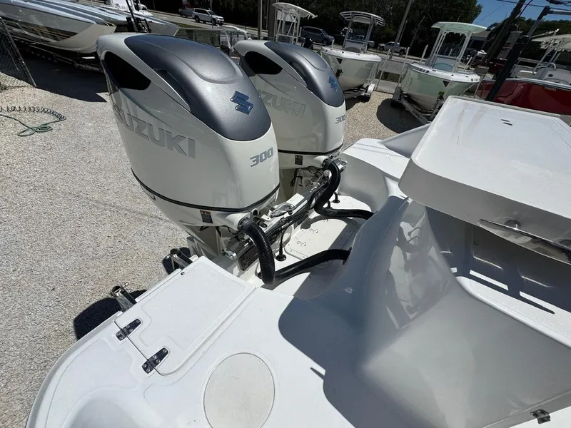 Slide: The Image of 2004 Boston Whaler 320 Outrage with twin Suzuki 300 outboard engines. - 6