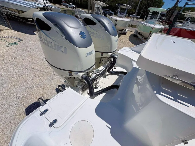 Slide: The Image of Twin Suzuki 300 outboard engines on a 2004 Boston Whaler 320 Outrage boat. - 7