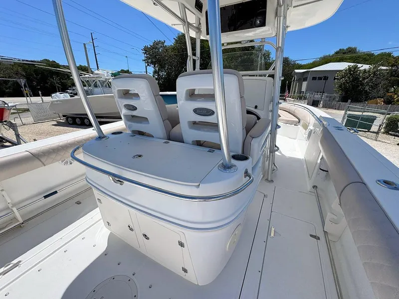 Slide: The Image of 2004 Boston Whaler 320 Outrage boat interior with seating and storage compartments. - 9