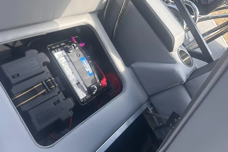 Slide: The Image of Battery compartment of 2025 Avalon 2385 LSZ boat, featuring secure storage and wiring. - 16