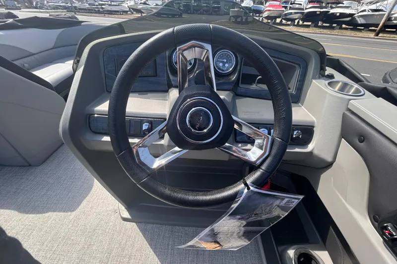 Slide: The Image of Steering wheel of 2025 Avalon 2385 LSZ boat, featuring modern dashboard controls. - 17