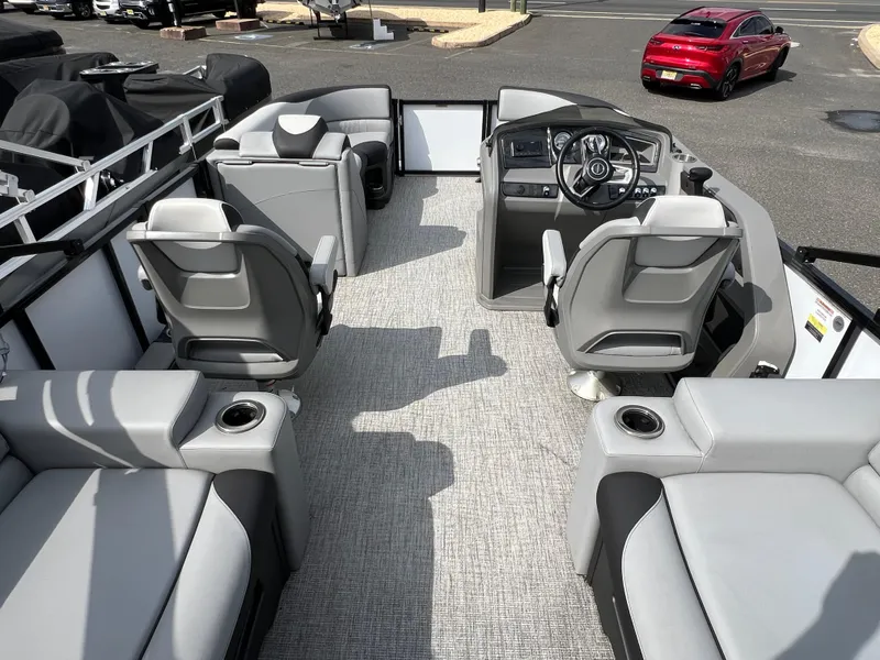 Slide: The Image of Interior of 2025 Avalon 2385 LSZ pontoon boat with modern seating and steering console. - 5