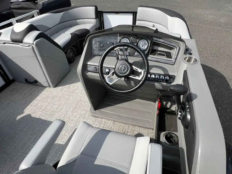 Slide: The Image of 2025 Avalon 2385 LSZ boat interior with steering wheel and seating. - 6
