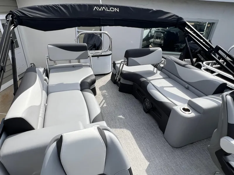 Slide: The Image of Luxurious 2025 Avalon 2385 LSZ pontoon boat interior with plush seating and modern design. - 9