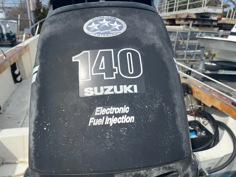 Slide: The Image of Outboard motor on 1992 Boston Whaler 19 Outrage with Suzuki 140 electronic fuel injection. - 10