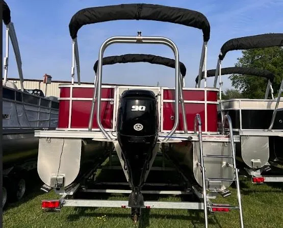 Slide: The Image of 2024 Landau Island Breeze 232 Cruise pontoon boat with outboard motor and ladder. - 7