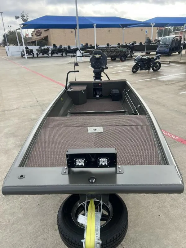 Slide: The Image of 2025 Gator Tail 17/48 Gator Series boat on trailer in parking lot. - 3