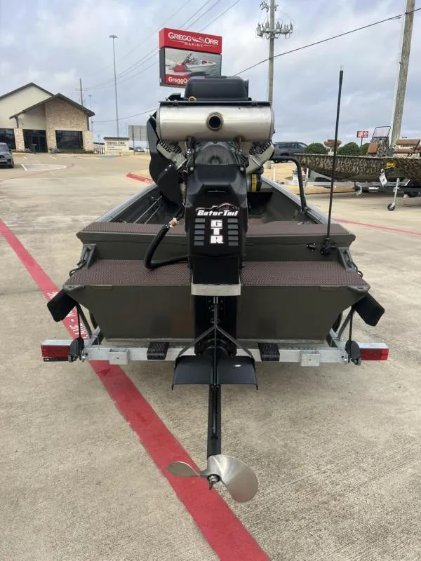 Slide: The Image of 2025 Gator Tail 17/48 Gator Series boat on trailer, rear view with motor. - 6