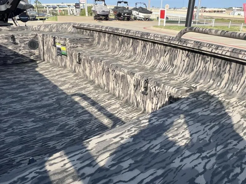 Slide: The Image of 2025 Havoc Boats 1653 MSTC interior with camouflage pattern, showcasing seating and storage. - 10