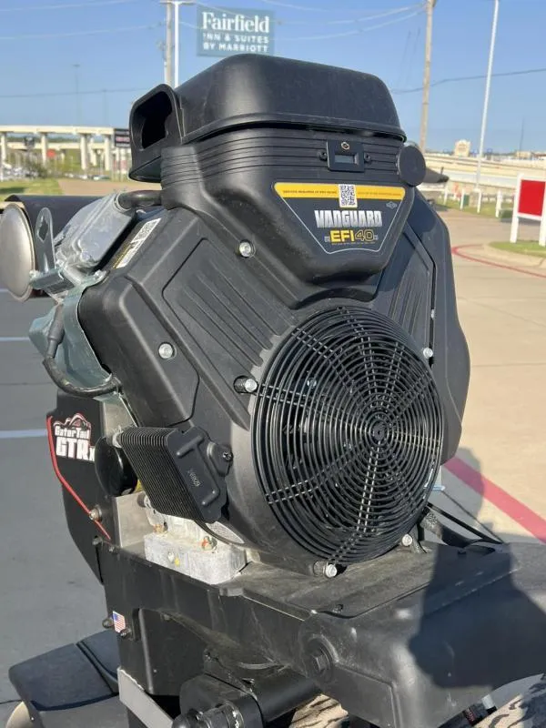 Slide: The Image of Vanguard EFI engine on a 2025 Havoc Boats 1653 MSTC, outdoor setting. - 14