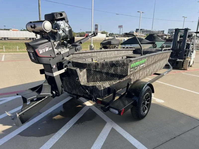 Slide: The Image of 2025 Havoc Boats 1653 MSTC on trailer, featuring camouflage design and powerful motor. - 5
